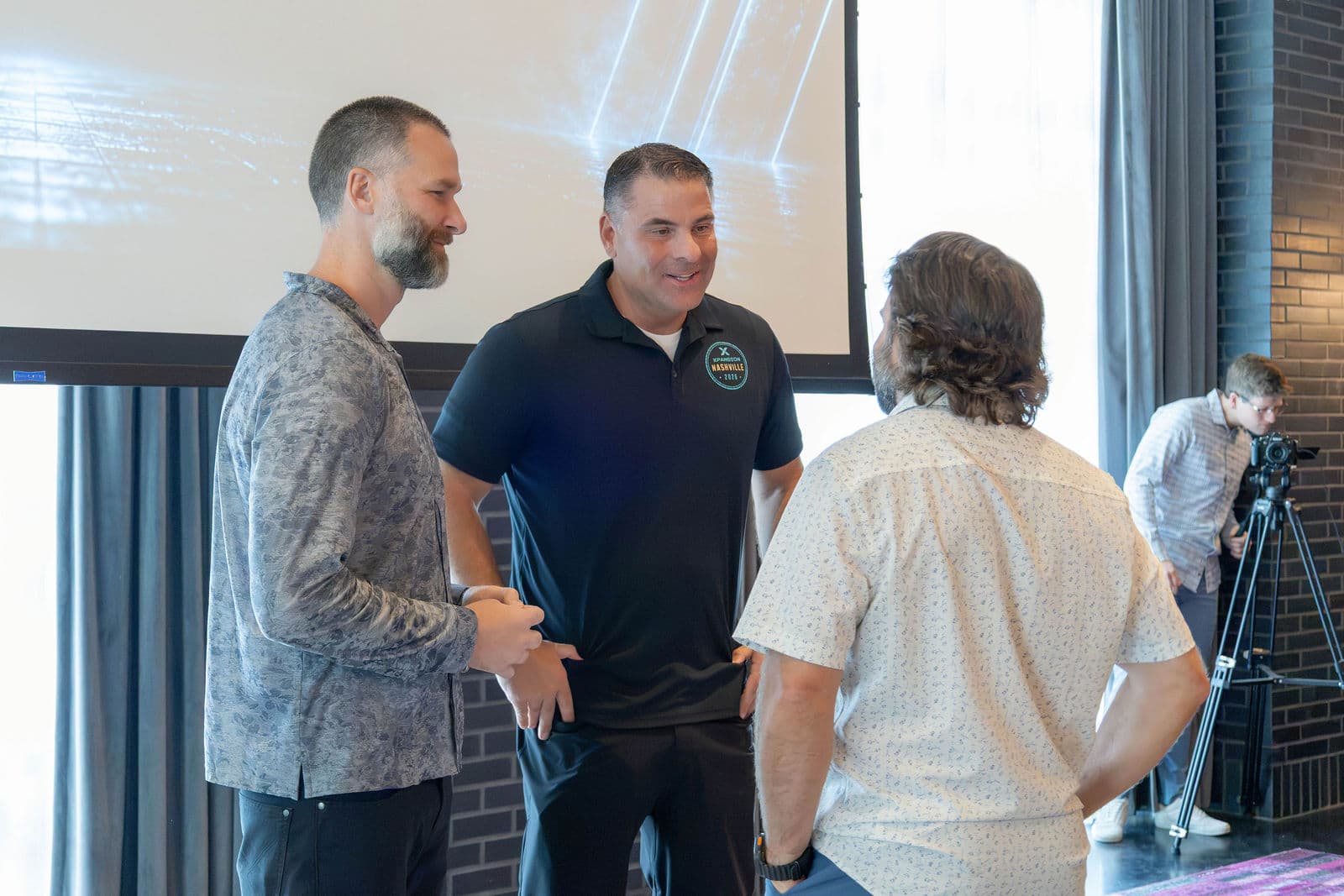 Jerremy and Spencer in conversation with attendee
